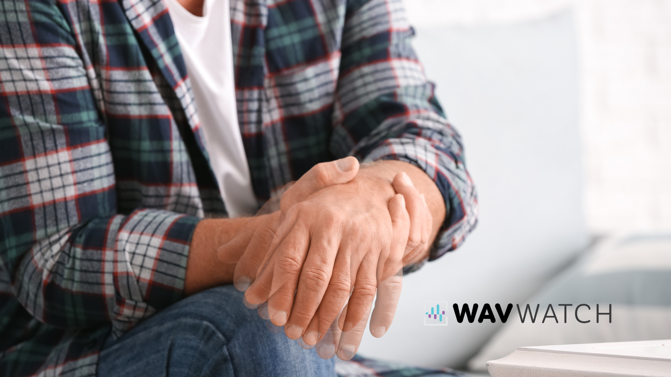 Image of Man Holding Other Hand to Lessen Tremors