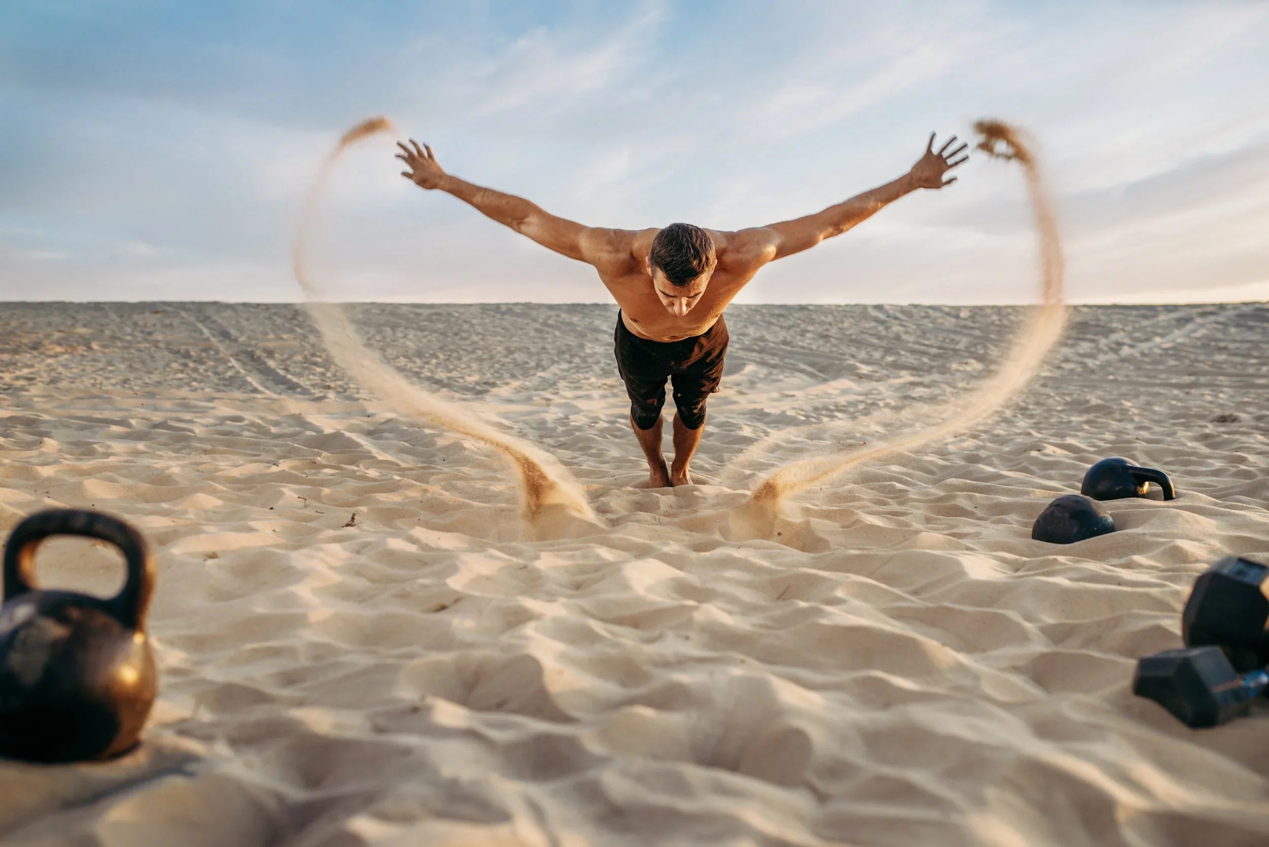 Image of Man Working Out on Beach