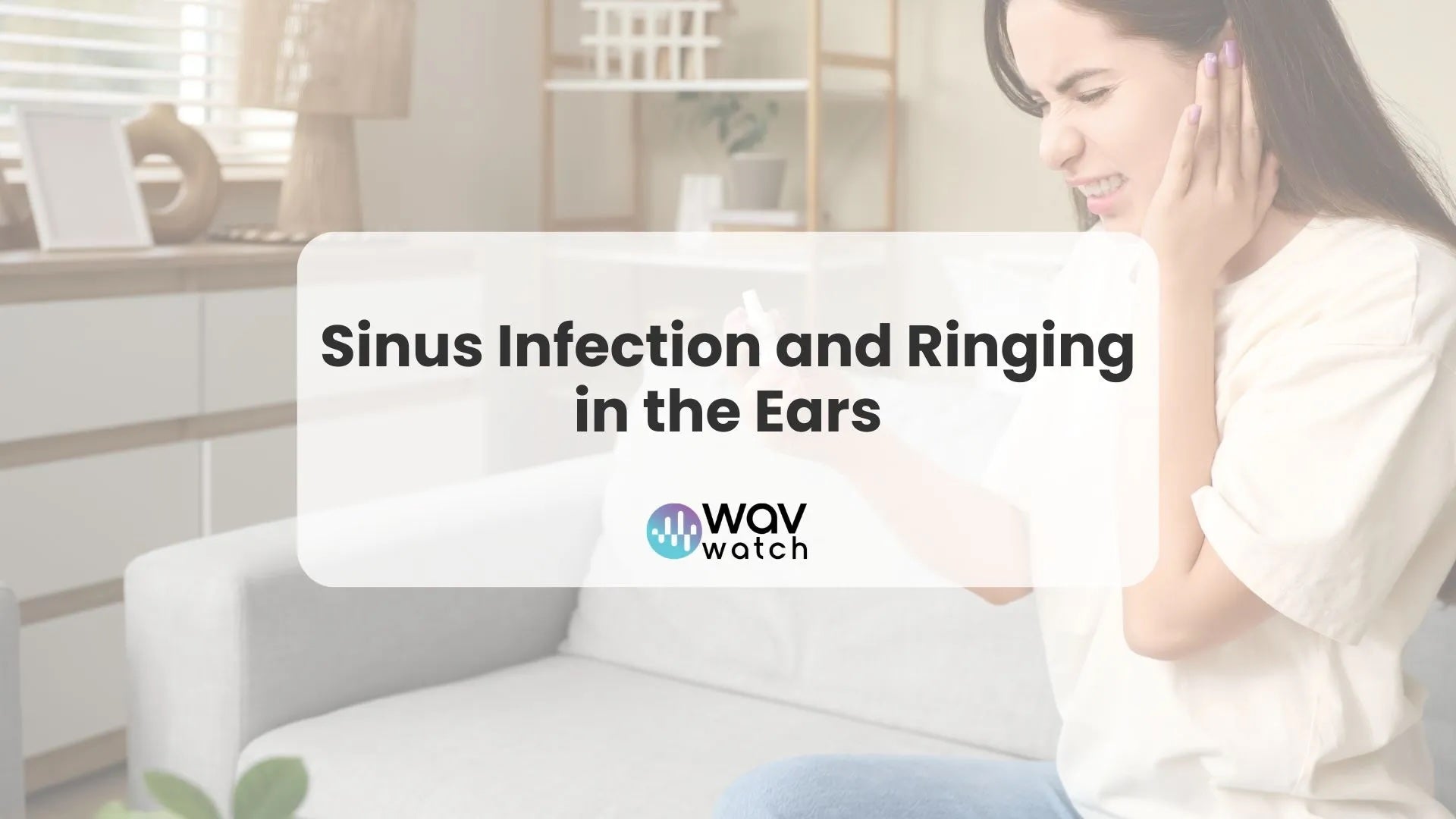 Image of woman holding her ear